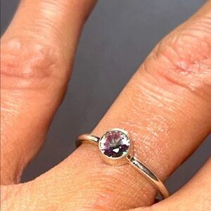 Elegant Gold Ring with Purple Gemstone